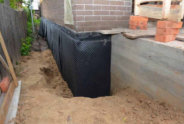 Happy homeowners after waterproofing job in Prattville
